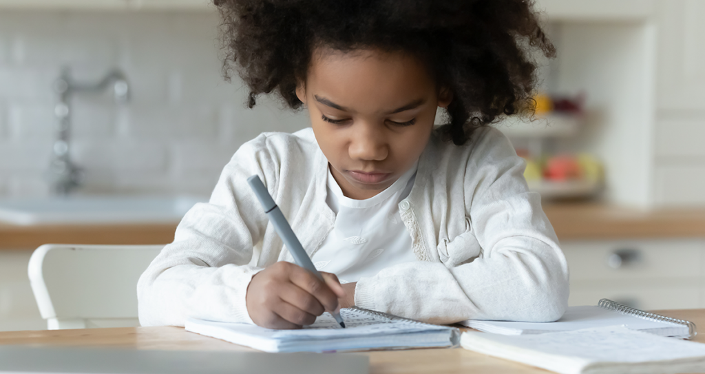 young African-American girl doing homework