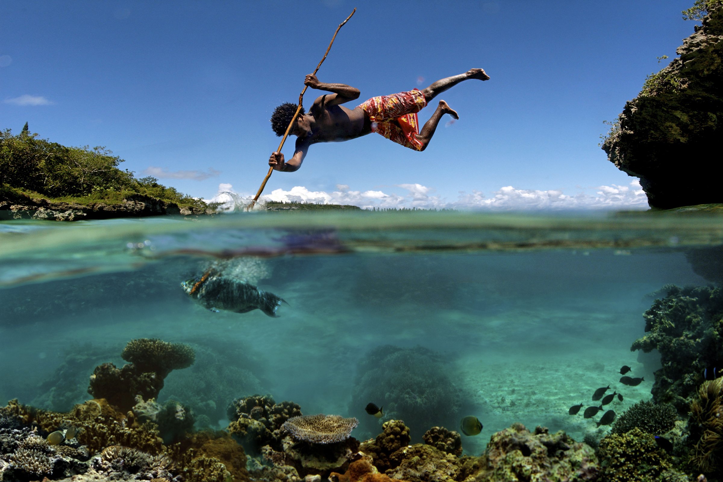 Hunter shows his full commitment while spear fishing.